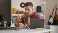 Young hispanic man radio reporter using microphone speaking at radio studio Royalty Free Stock Photo