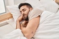 Young hispanic man sleeping on bed at bedroom Royalty Free Stock Photo