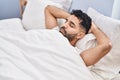 Young hispanic man sleeping on bed at bedroom Royalty Free Stock Photo