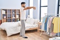 Young hispanic man sleepwalking at bedroom Royalty Free Stock Photo