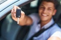 Young hispanic man smiling confident holding key of new car at street Royalty Free Stock Photo