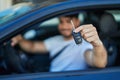 Young hispanic man smiling confident holding key of new car at street Royalty Free Stock Photo