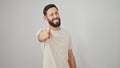 Young hispanic man smiling confident pointing to camera winking eye over isolated white background Royalty Free Stock Photo