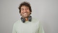 Young hispanic man smiling confident wearing headphones over isolated white background Royalty Free Stock Photo