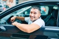 Young hispanic man smiling happy driving car Royalty Free Stock Photo