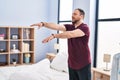 Young hispanic man somnambulist sleepwalking at bedroom Royalty Free Stock Photo