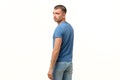 Young hispanic man turning back looking serious. Royalty Free Stock Photo