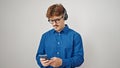 Young hispanic man using smartphone wearing headphones over isolated white background Royalty Free Stock Photo