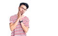 Young hispanic man wearing casual clothes tired hands covering face, depression and sadness, upset and irritated for problem Royalty Free Stock Photo