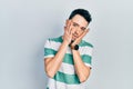 Young hispanic man wearing casual clothes tired hands covering face, depression and sadness, upset and irritated for problem Royalty Free Stock Photo