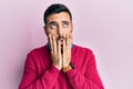 Young hispanic man wearing casual clothes tired hands covering face, depression and sadness, upset and irritated for problem Royalty Free Stock Photo