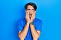 Young hispanic man wearing casual clothes tired hands covering face, depression and sadness, upset and irritated for problem Royalty Free Stock Photo