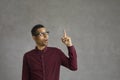 Young hispanic man wearing glasses over isolated black background making a hand gesture Royalty Free Stock Photo