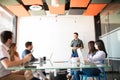 Businessman giving a sales pitch to team Royalty Free Stock Photo