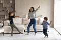 Young hispanic mother dancing with small children. Royalty Free Stock Photo