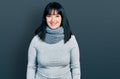 Young hispanic plus size woman wearing winter scarf with a happy and cool smile on face Royalty Free Stock Photo