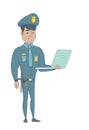 Young hispanic policeman using a laptop. Royalty Free Stock Photo