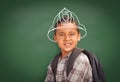 Young Hispanic Student Boy Wearing Backpack Front Of Blackboard with Fireman Helmet Drawn In Chalk Over Head Royalty Free Stock Photo