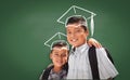 Young Hispanic Student Boys Wearing Backpack Front Of Blackboard with Fireman Helmet Drawn In Chalk Over Head