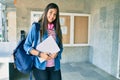 Young hispanic student girl smiling happy holding laptop at the city Royalty Free Stock Photo