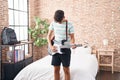 Young hispanic teenager musician playing electrical guitar at bedroom Royalty Free Stock Photo