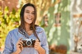 Young hispanic tourist girl smiling happy using camera at the park Royalty Free Stock Photo