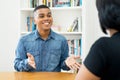 Young hispanic trainee talking at job interview Royalty Free Stock Photo