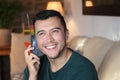 Young hispanic using retro style landline cordless phone Royalty Free Stock Photo