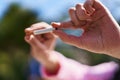 Young hispanic woman breaking cigarette at park Royalty Free Stock Photo