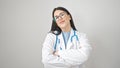 Young hispanic woman doctor smiling confident standing with arms crossed gesture over isolated white background Royalty Free Stock Photo