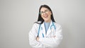 Young hispanic woman doctor smiling confident standing with arms crossed gesture over isolated white background Royalty Free Stock Photo