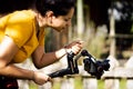 Young hispanic woman holding gimbal while making video outside