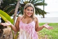Young hispanic woman outdoors by the park celebrating achievement with happy smile and winner expression with raised hand Royalty Free Stock Photo