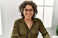 Young hispanic woman smiling confident wearing headset working at office Royalty Free Stock Photo