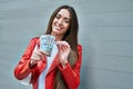 Young hispanic woman smiling happy counting peruvian sol banknotes at the city Royalty Free Stock Photo