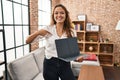 Young hispanic woman using laptop showing blank screen at home pointing finger to one self smiling happy and proud Royalty Free Stock Photo