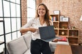 Young hispanic woman using laptop showing blank screen at home smiling happy pointing with hand and finger Royalty Free Stock Photo