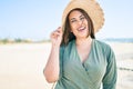 Young hispanic woman on vacation smiling happy walking at the beach Royalty Free Stock Photo