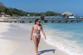 Young Hispanic woman walking at the beach Royalty Free Stock Photo