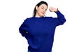 Young hispanic woman wearing casual clothes stretching back, tired and relaxed, sleepy and yawning for early morning