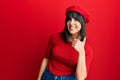 Young hispanic woman wearing french look with beret doing happy thumbs up gesture with hand Royalty Free Stock Photo