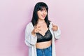 Young hispanic woman wearing lingerie pointing fingers to camera with happy and funny face Royalty Free Stock Photo