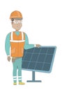 Young hispanic worker of solar power plant