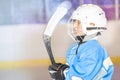 Young hockey player preparing to go out on rink