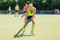 Young hockey player woman with ball in attack