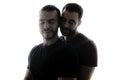 Young homosexuals shadow couple love each other on a white background.