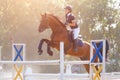 Young horse rider girl on show jumping competition Royalty Free Stock Photo