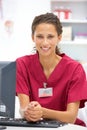 Young hospital doctor at desk