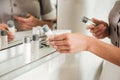 Young hotel maid putting bath accessories in a bathroom Royalty Free Stock Photo