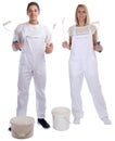 Young house painters decorators apprentice trainees paint bucket Royalty Free Stock Photo